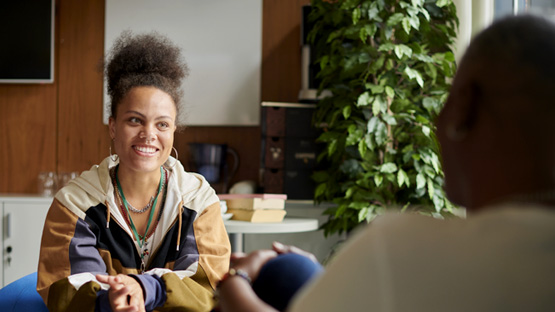 Photo of young woman attending a meeting